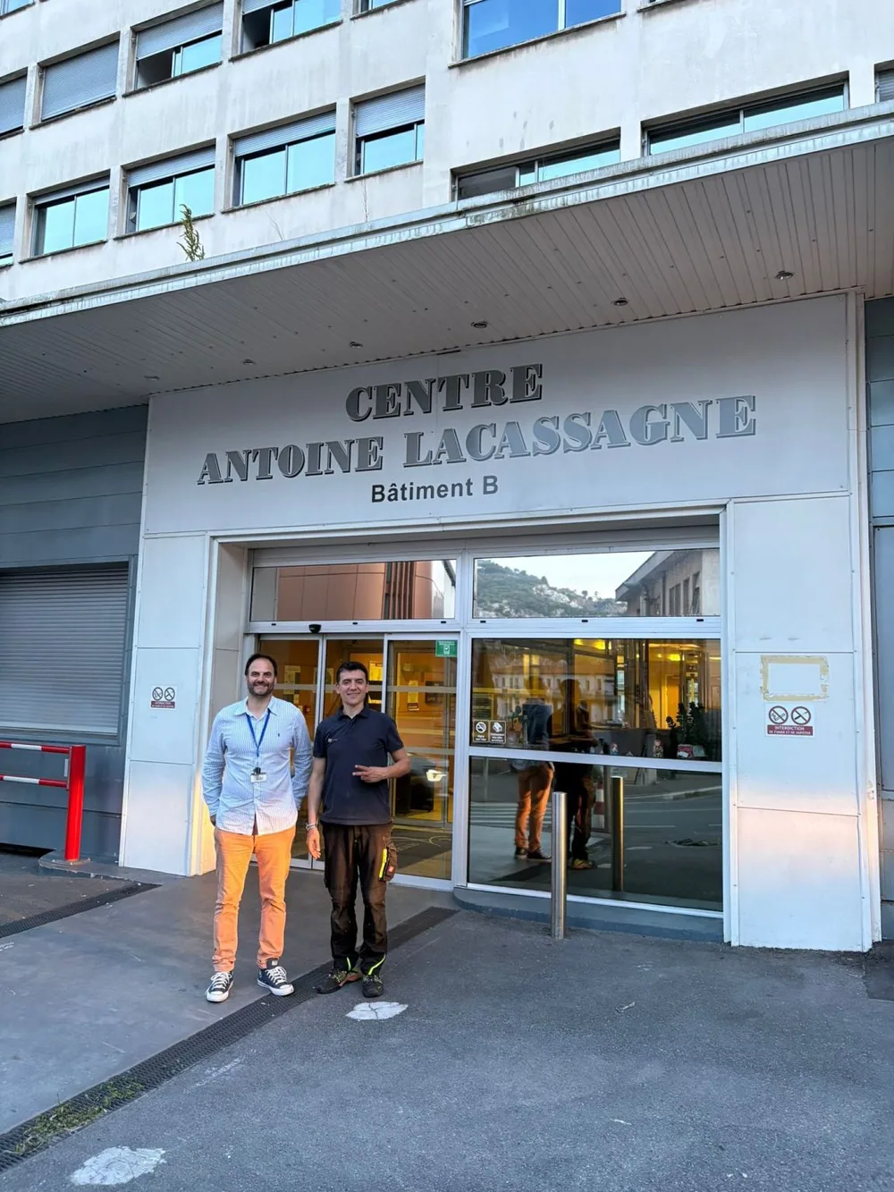 Team members at the Centre Antoine Lacassagne entrance — Centre Antoine Lacassagne, France
