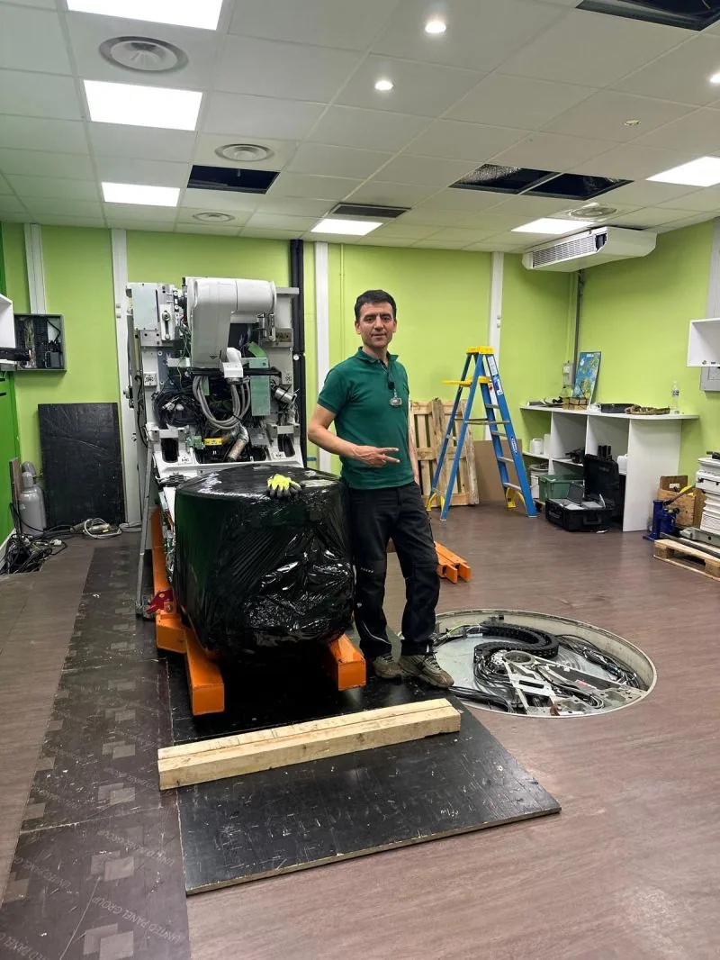 Team member beside the wrapped unit on its transport frame — Hôpital Lyon Sud