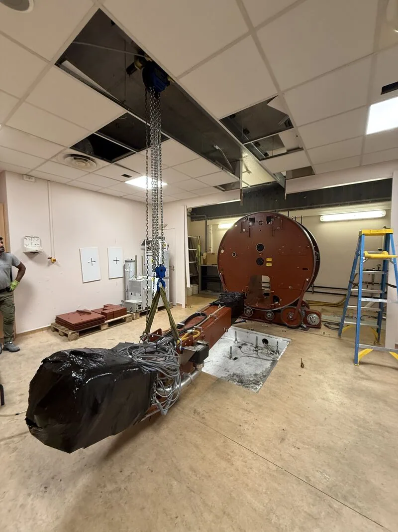 Partly wrapped LINAC arm attached to a hoist — Bobigny – IRHE