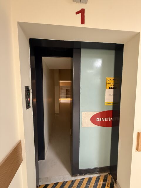 Partly closed sliding door at the treatment-room entrance — Bursa Uludağ