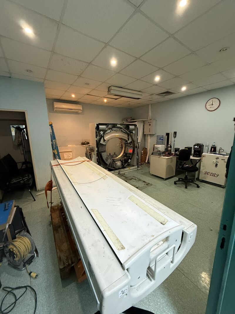 CT scanner with covers removed beside the patient table — Bursa Uludağ
