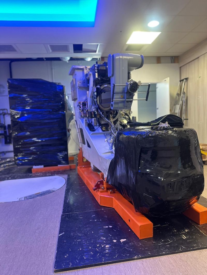 Partly wrapped LINAC on an orange transport frame — Carcassonne