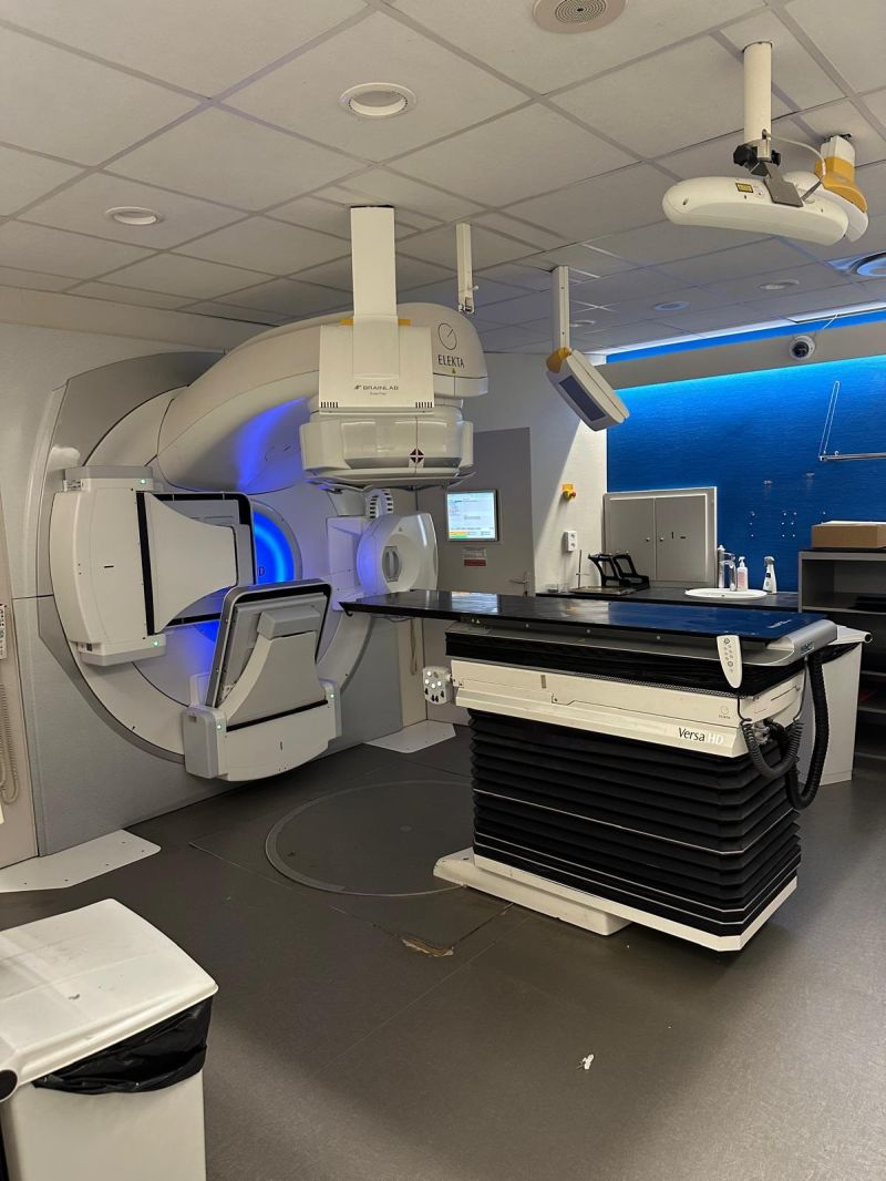 LINAC and patient table in the treatment room — Dijon