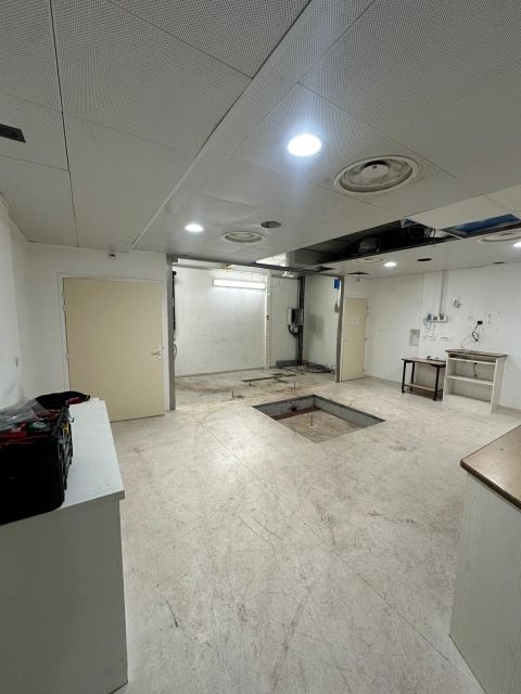 Open equipment mounting pit in the empty treatment room — Forcilles