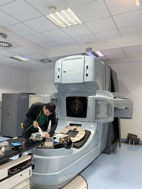 Work at the table and control area in front of the LINAC — Iași