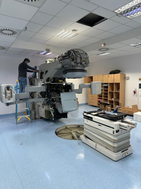 Team member working on the exposed LINAC head — Iași