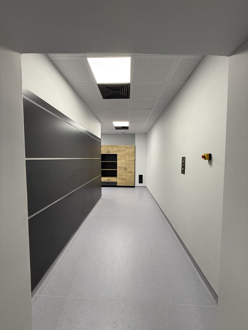 Interior corridor with wall finishes and lighting — Rize