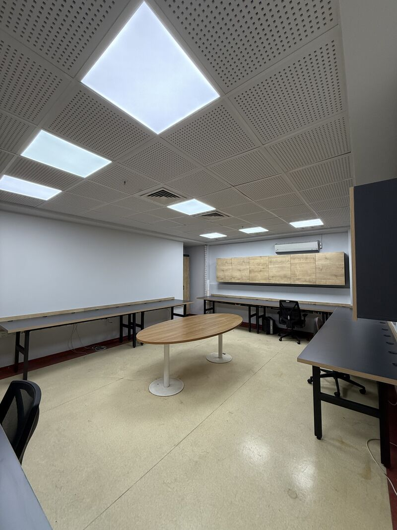 Meeting table and surrounding work counters — Rize