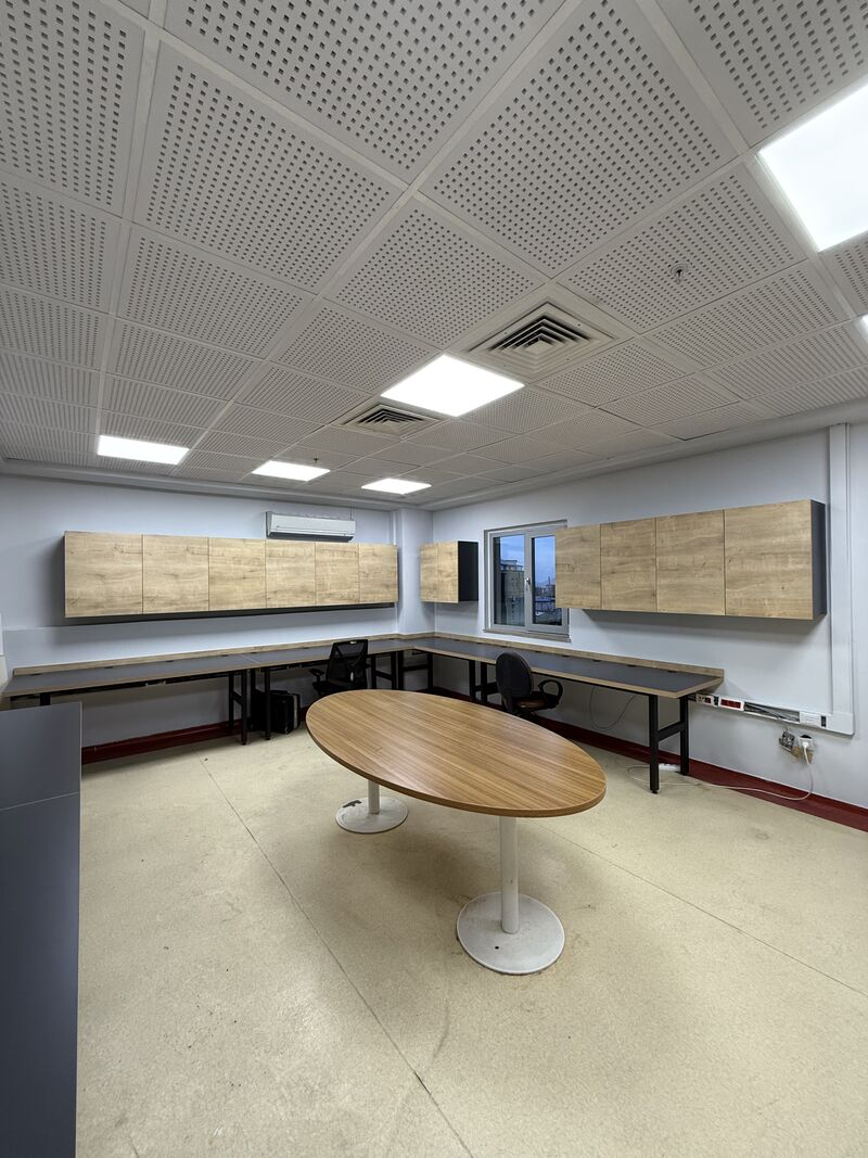Meeting table and surrounding work counters — Rize