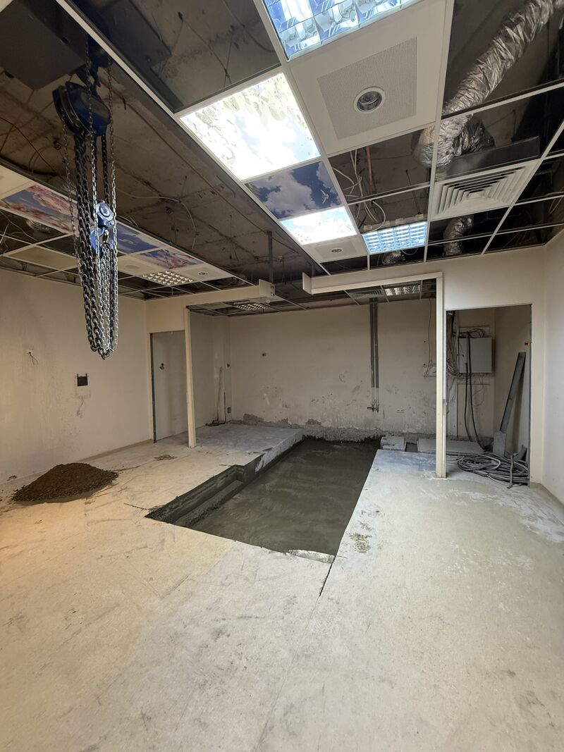 Open equipment pit and removed ceiling panels — Rize