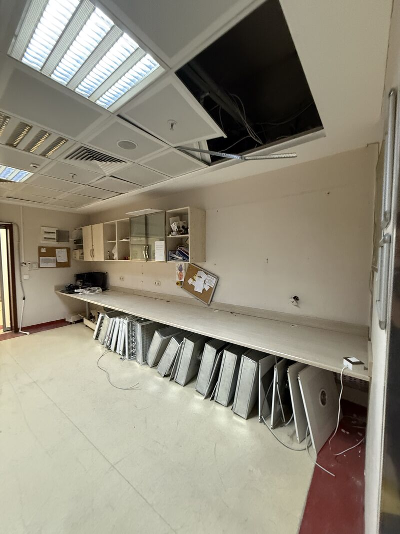 Removed panels arranged along the room counter — Rize